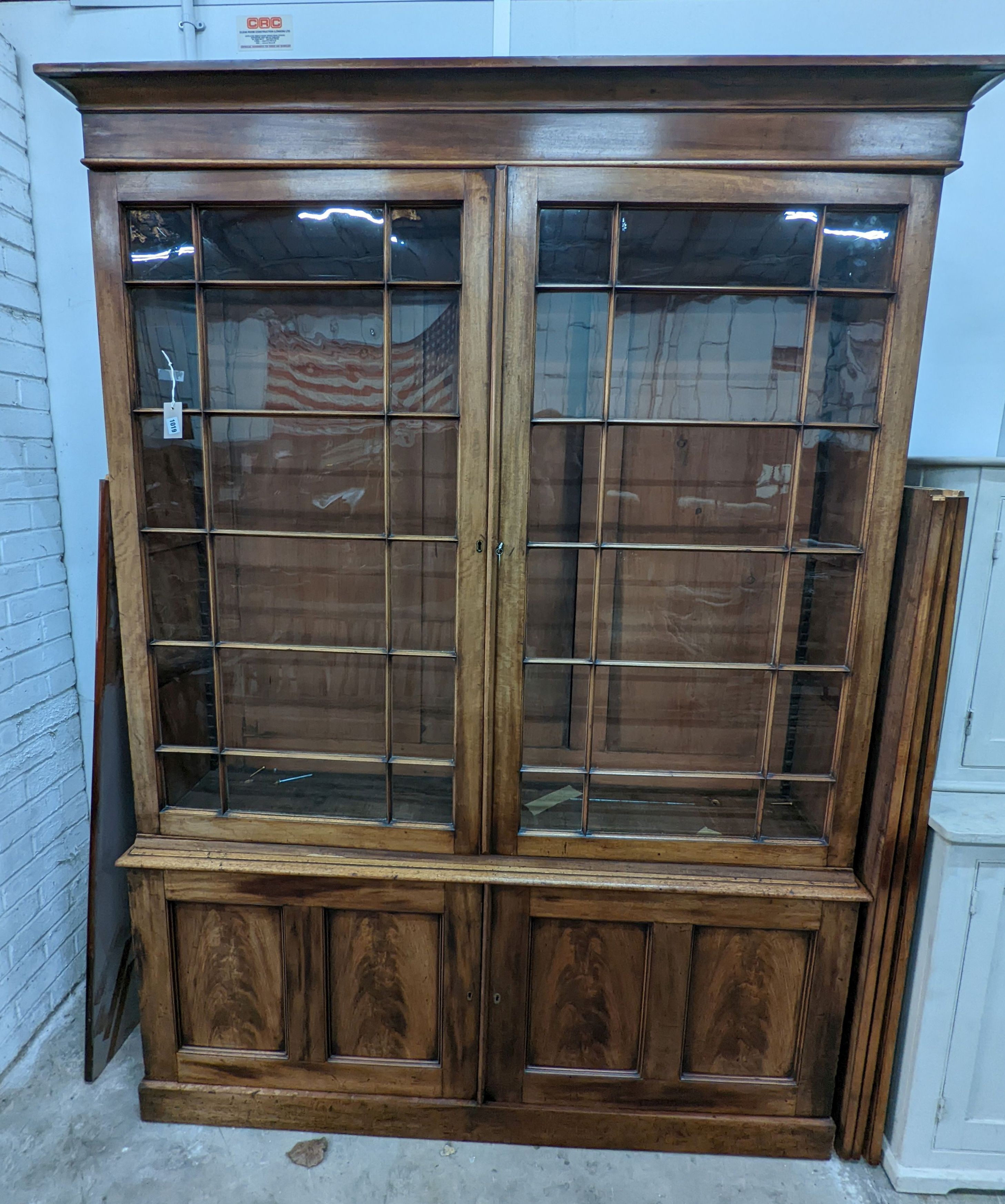 A George III style mahogany library bookcase, width 154cm, depth 38cm, height 217cm